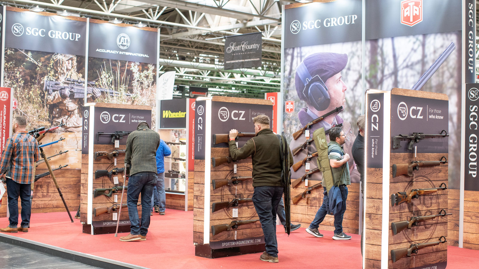 Visitors to The British Shooting Show look at the CZ rifles on display at the Sportsman Gun Centre stand